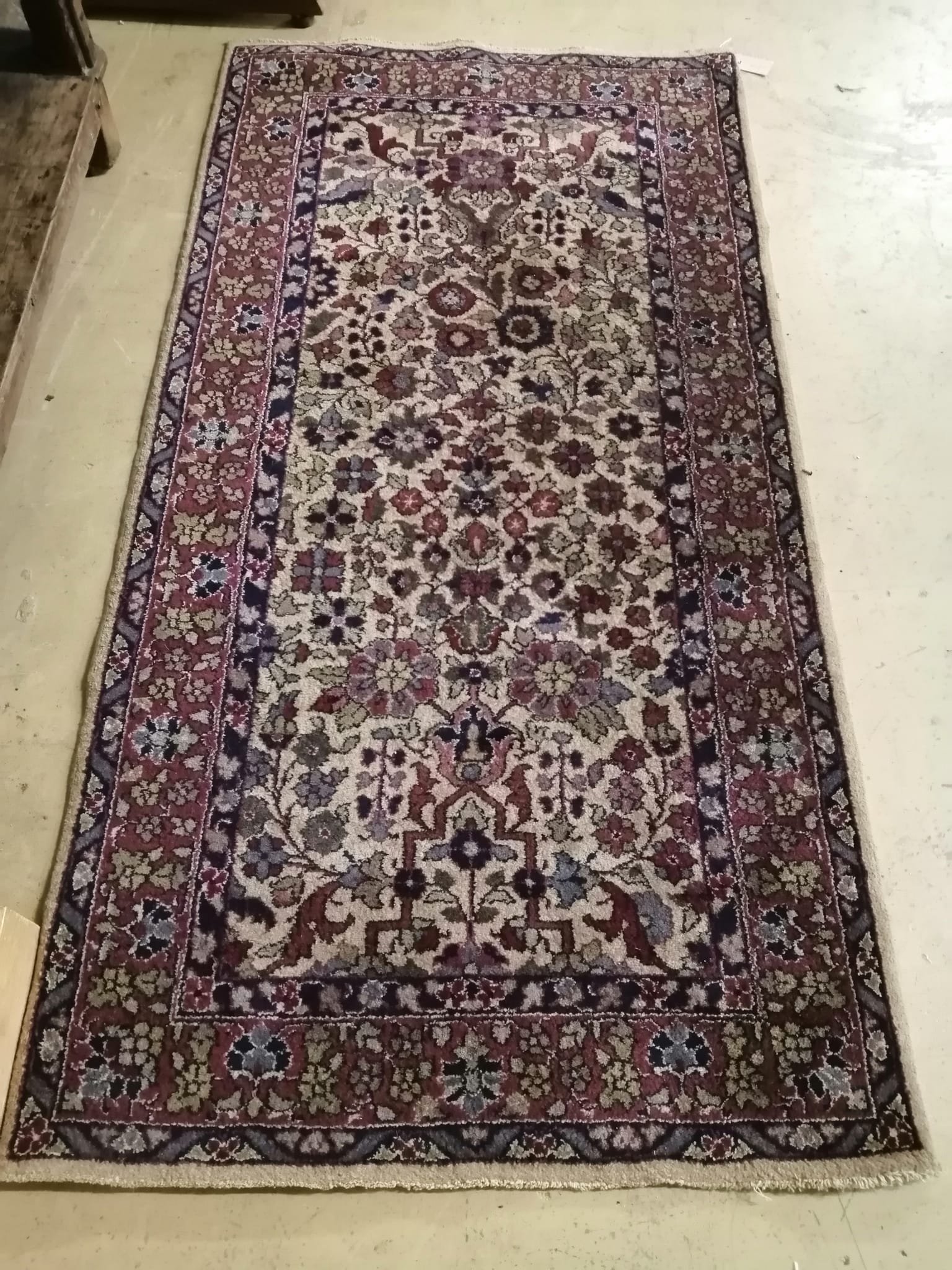 A North West Persian ivory ground rug, 182 x 93cm